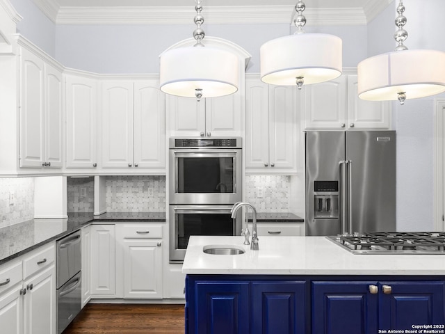 kitchen with dark hardwood / wood-style flooring, backsplash, blue cabinetry, and stainless steel appliances