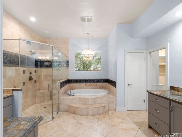 bathroom with tile flooring, plus walk in shower, and vanity