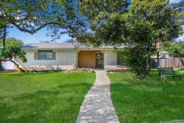 ranch-style home with a front yard