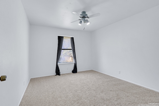 spare room with ceiling fan and carpet flooring