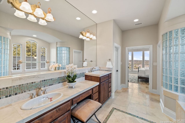 bathroom featuring dual sinks, tile floors, tasteful backsplash, and oversized vanity