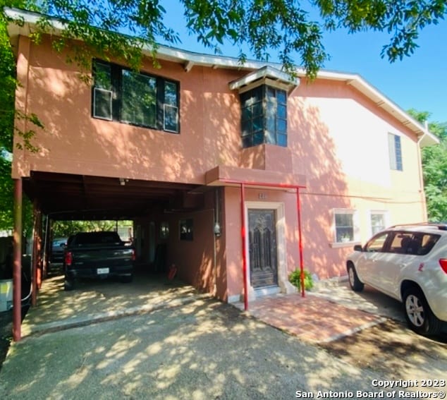 view of front of property with a carport