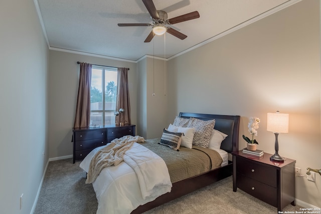 carpeted bedroom featuring crown molding and ceiling fan