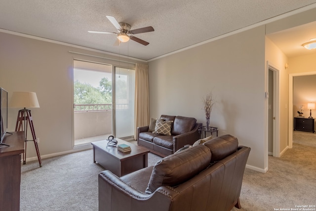 carpeted living room with crown molding, a textured ceiling, and ceiling fan