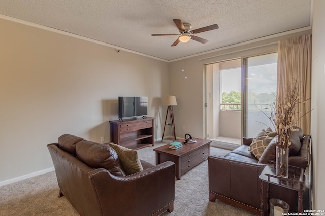 carpeted living room featuring a textured ceiling, crown molding, and ceiling fan