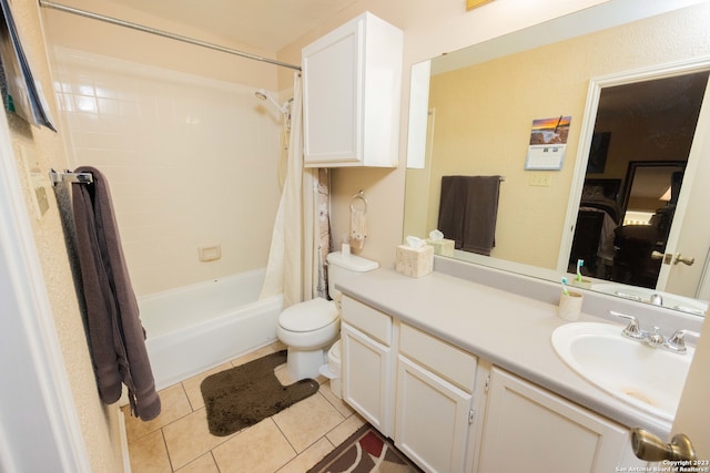 full bathroom featuring tile patterned flooring, vanity, toilet, and shower / tub combo with curtain