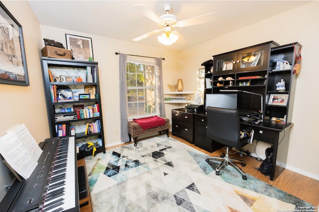 office area with ceiling fan and light hardwood / wood-style flooring