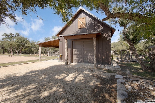 garage featuring a carport