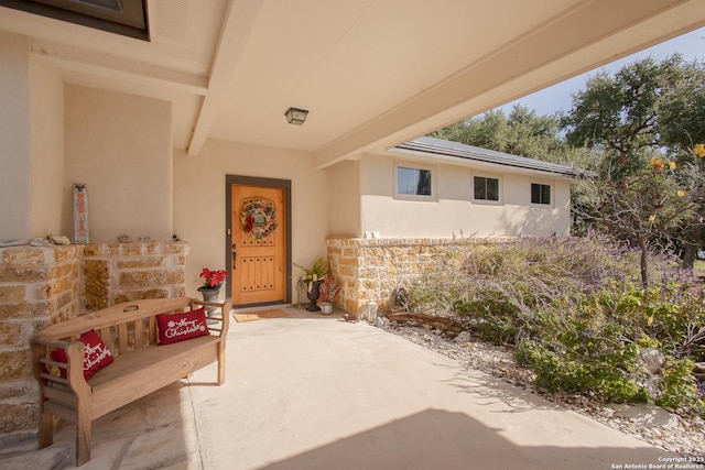 property entrance featuring a patio