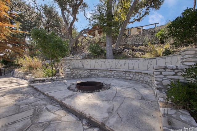 view of patio / terrace featuring a fire pit