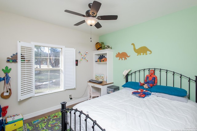 bedroom featuring hardwood / wood-style flooring and ceiling fan