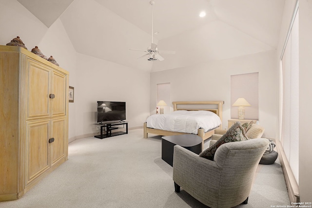 carpeted bedroom with ceiling fan and high vaulted ceiling