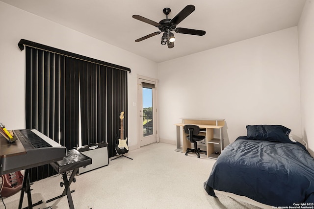 bedroom with ceiling fan and light carpet