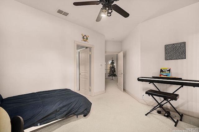 bedroom with light carpet and ceiling fan