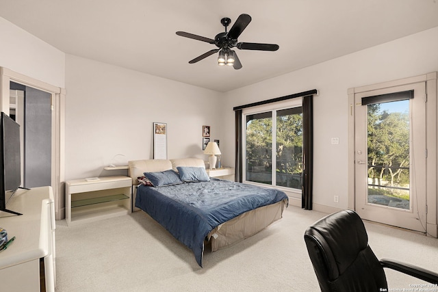 bedroom with access to exterior, ceiling fan, light carpet, and multiple windows