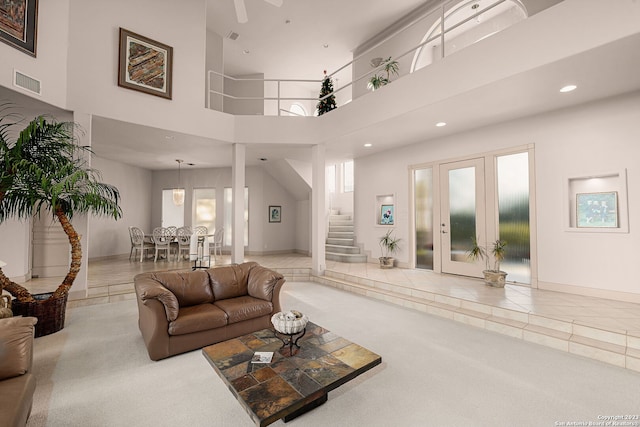 living room featuring a high ceiling