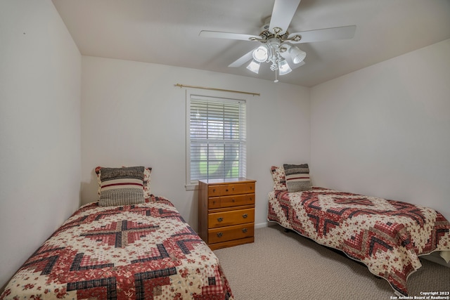 bedroom with light carpet and ceiling fan