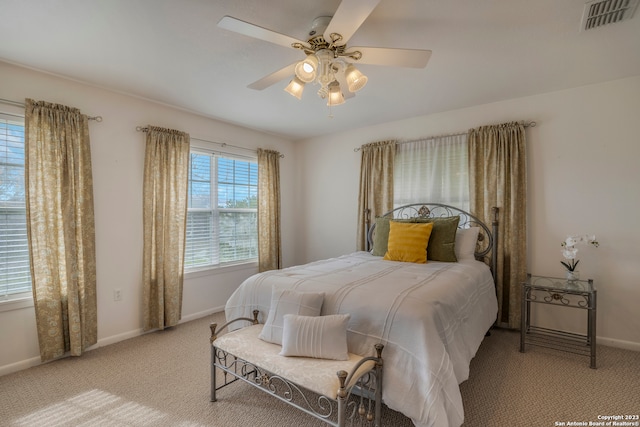 carpeted bedroom with ceiling fan