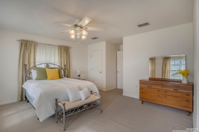 carpeted bedroom with ceiling fan