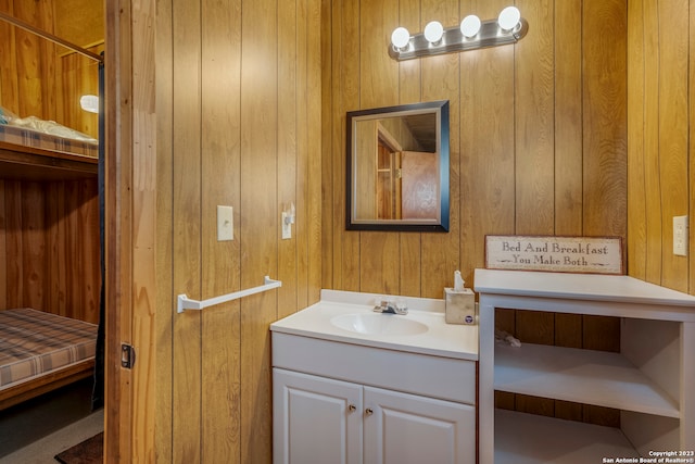 bathroom with wooden walls and large vanity