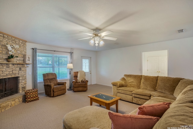 living room with ceiling fan, a fireplace, and carpet floors