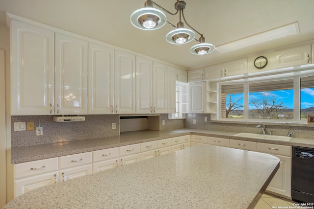 kitchen featuring white cabinetry and dishwasher