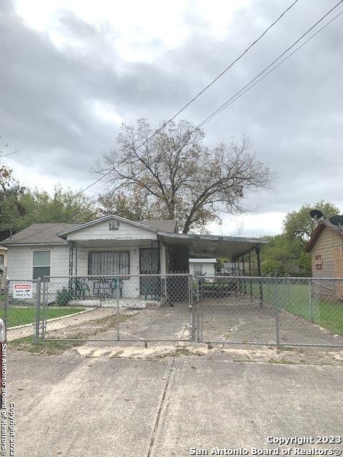 view of front of home with a carport