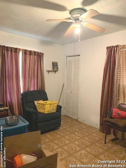 living room with ceiling fan