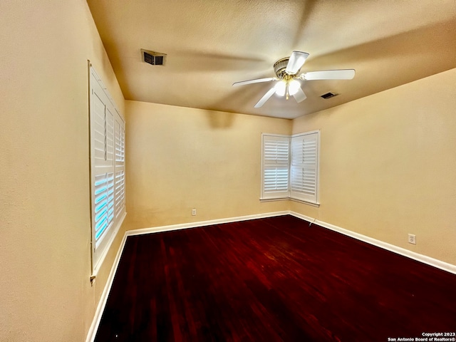 spare room featuring ceiling fan and wood-type flooring