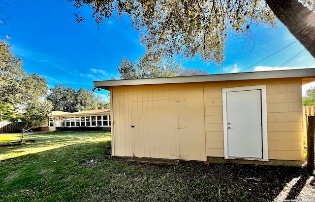 view of outdoor structure with a yard