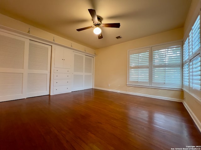 unfurnished bedroom featuring ceiling fan and wood-type flooring