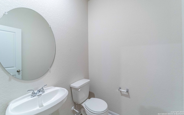 bathroom with sink and toilet