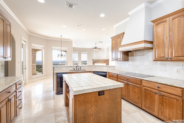 kitchen with custom range hood, black appliances, kitchen peninsula, decorative light fixtures, and backsplash