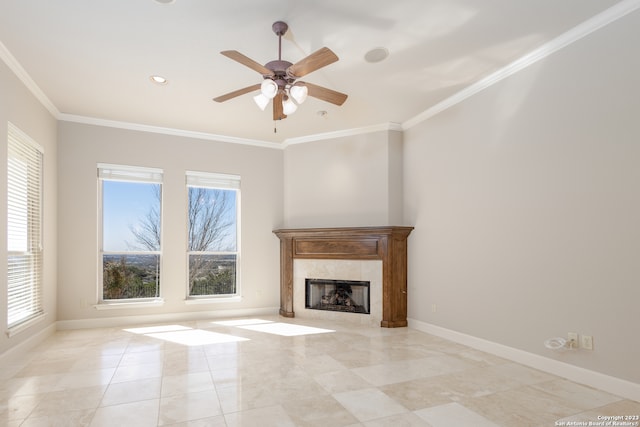 unfurnished living room with ceiling fan, a tile fireplace, light tile flooring, and ornamental molding