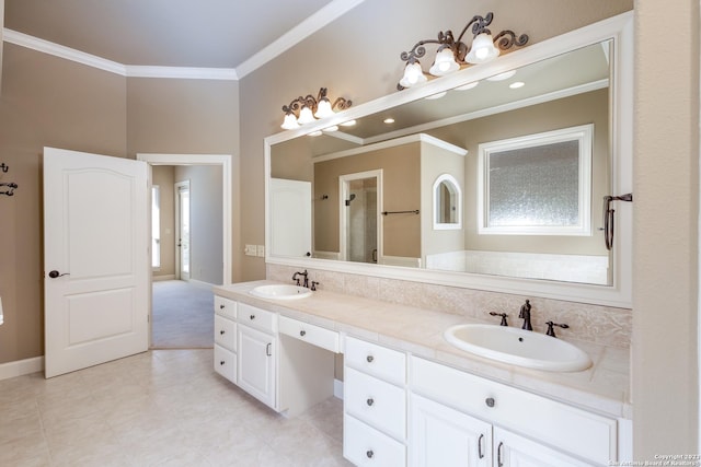 bathroom with double vanity, an enclosed shower, a sink, and crown molding