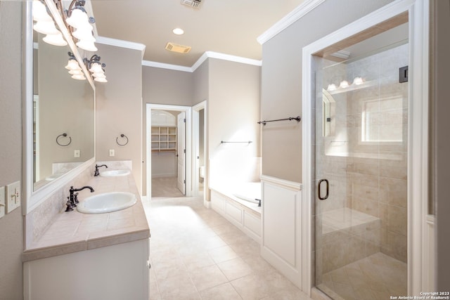 bathroom featuring ornamental molding, a garden tub, and a sink