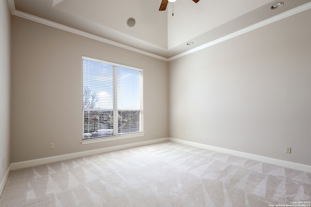 spare room featuring ceiling fan, crown molding, and carpet flooring