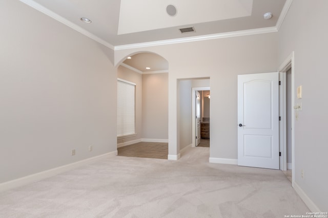 unfurnished bedroom featuring light carpet and ornamental molding