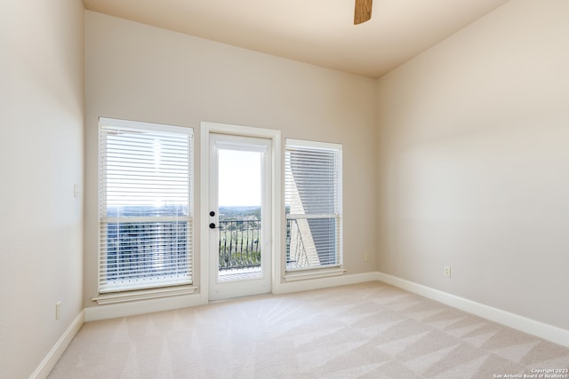 carpeted empty room featuring a healthy amount of sunlight