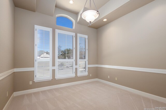 empty room with light carpet, recessed lighting, and baseboards