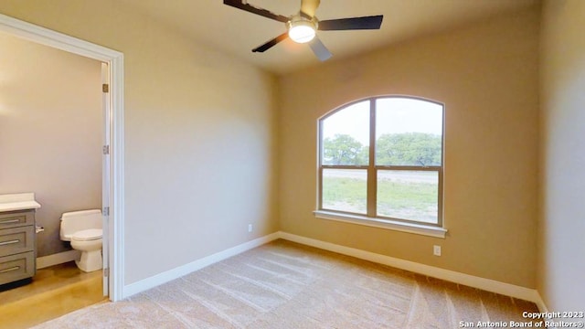 unfurnished room with light carpet and ceiling fan