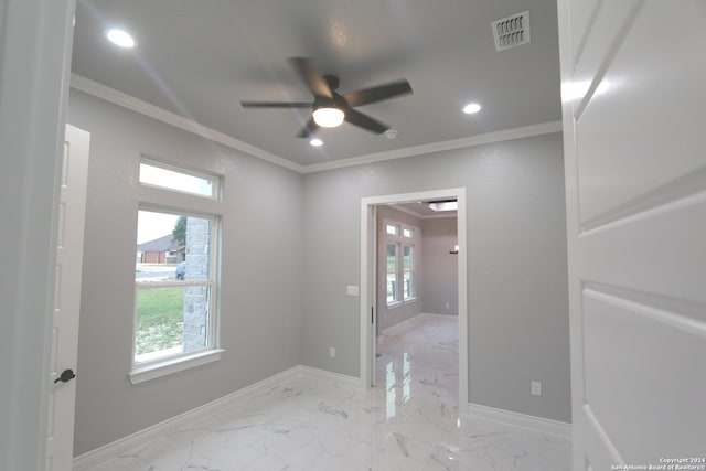 unfurnished room featuring ceiling fan, crown molding, and a healthy amount of sunlight