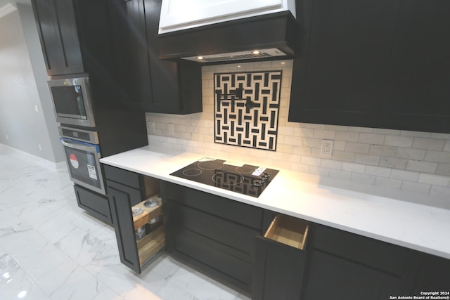 kitchen with stainless steel appliances, premium range hood, and decorative backsplash