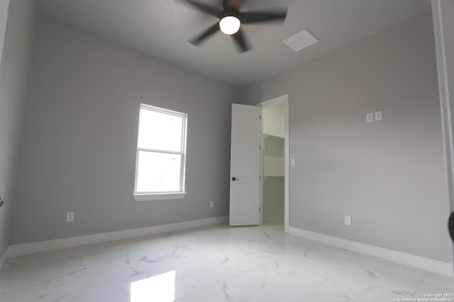 unfurnished bedroom featuring ceiling fan