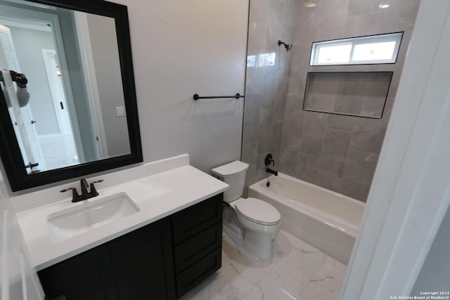 full bathroom featuring vanity, toilet, and tiled shower / bath