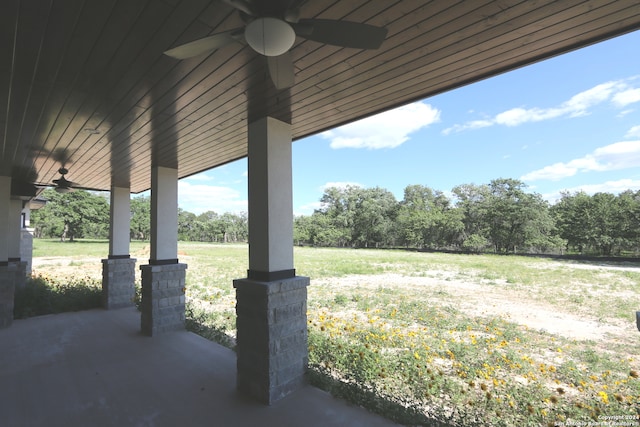 view of yard with ceiling fan