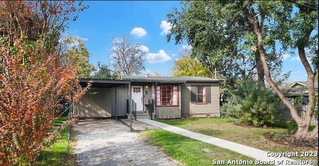 ranch-style house with a carport