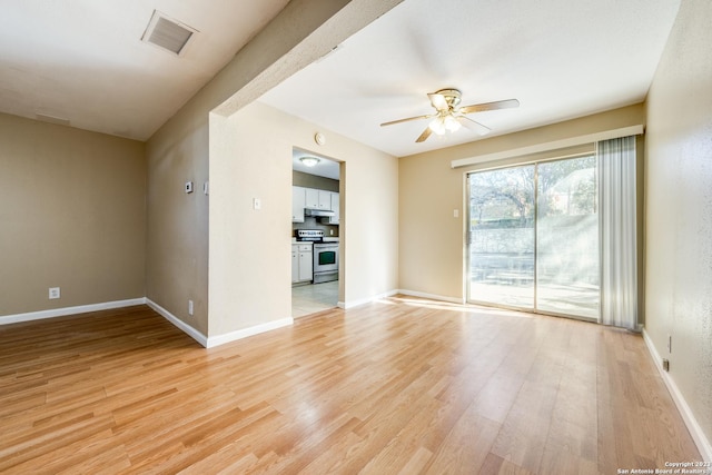 unfurnished living room with light hardwood / wood-style flooring and ceiling fan