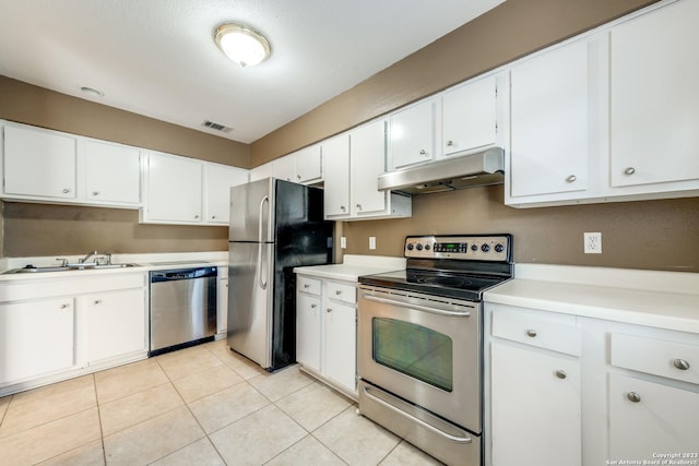 kitchen with white cabinetry, sink, light tile patterned floors, and appliances with stainless steel finishes