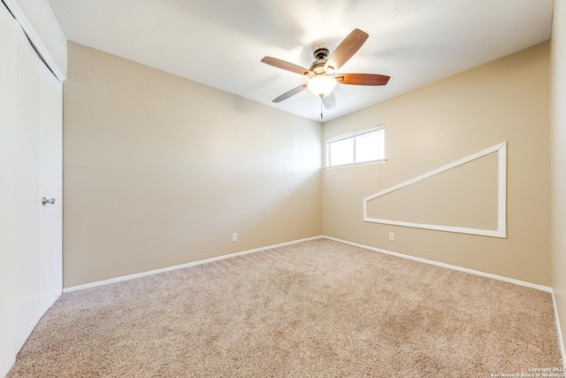 empty room with carpet floors and ceiling fan